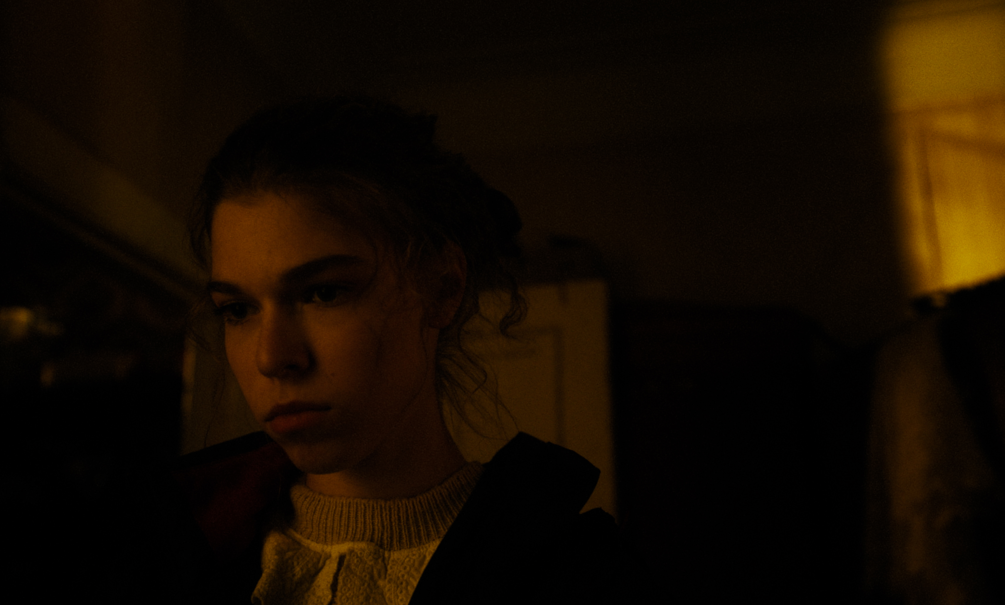 A close-up in Kira’s Dream: silence, shadow, and a face that doesn’t explain itself.